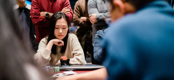 woman sitting at poker table