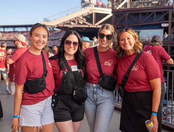 women in red shirts at Phillies game