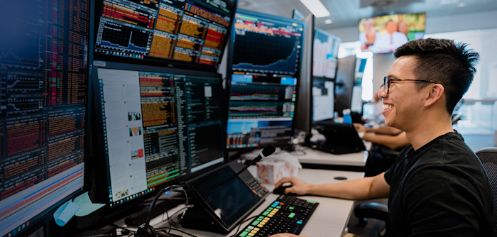 A person working at a trading desk