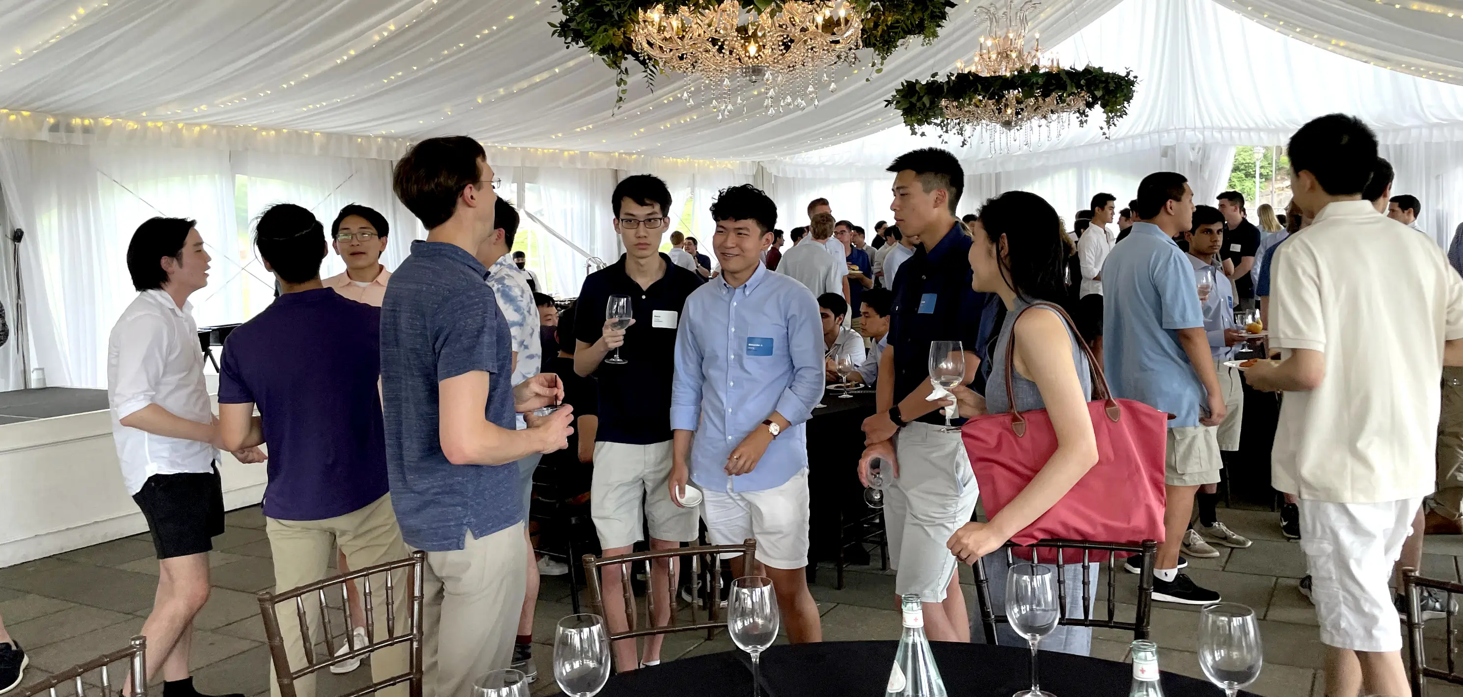 Interns and coops standing at a party