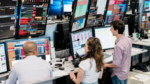 traders looking at monitors 